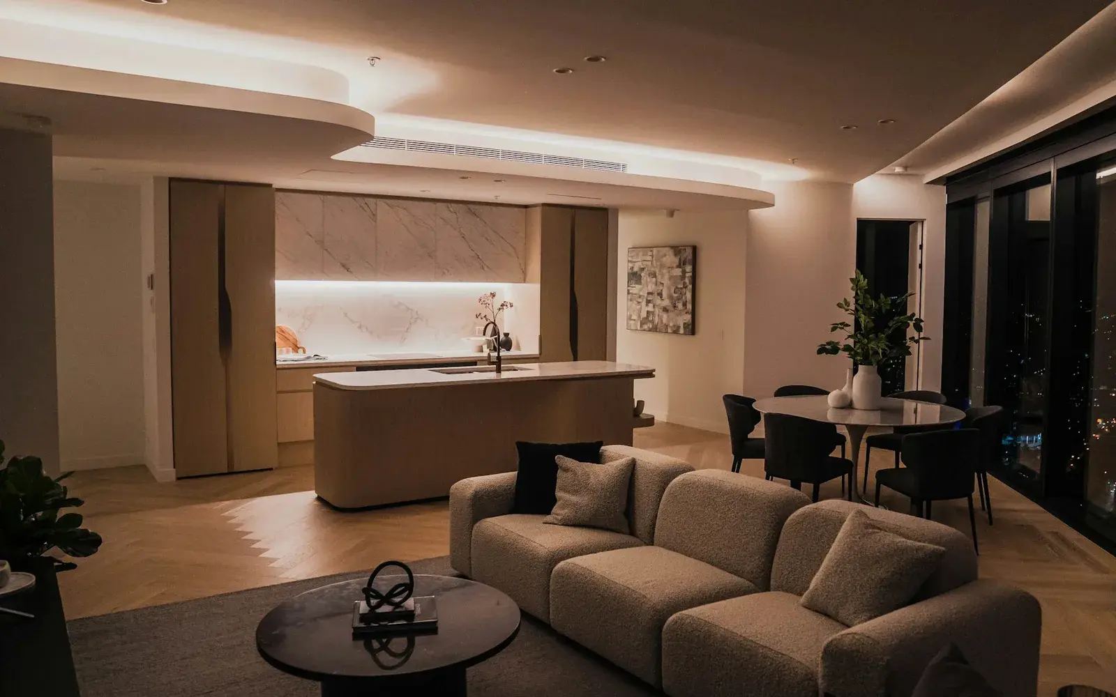 Warmly lit open plan living room with a cove lit false ceiling, by Nestora Interiors, interior designer in Hyderabad Warmly lit open plan living room with a cove lit false ceiling, by Nestora Interiors, interior designer in Hyderabad